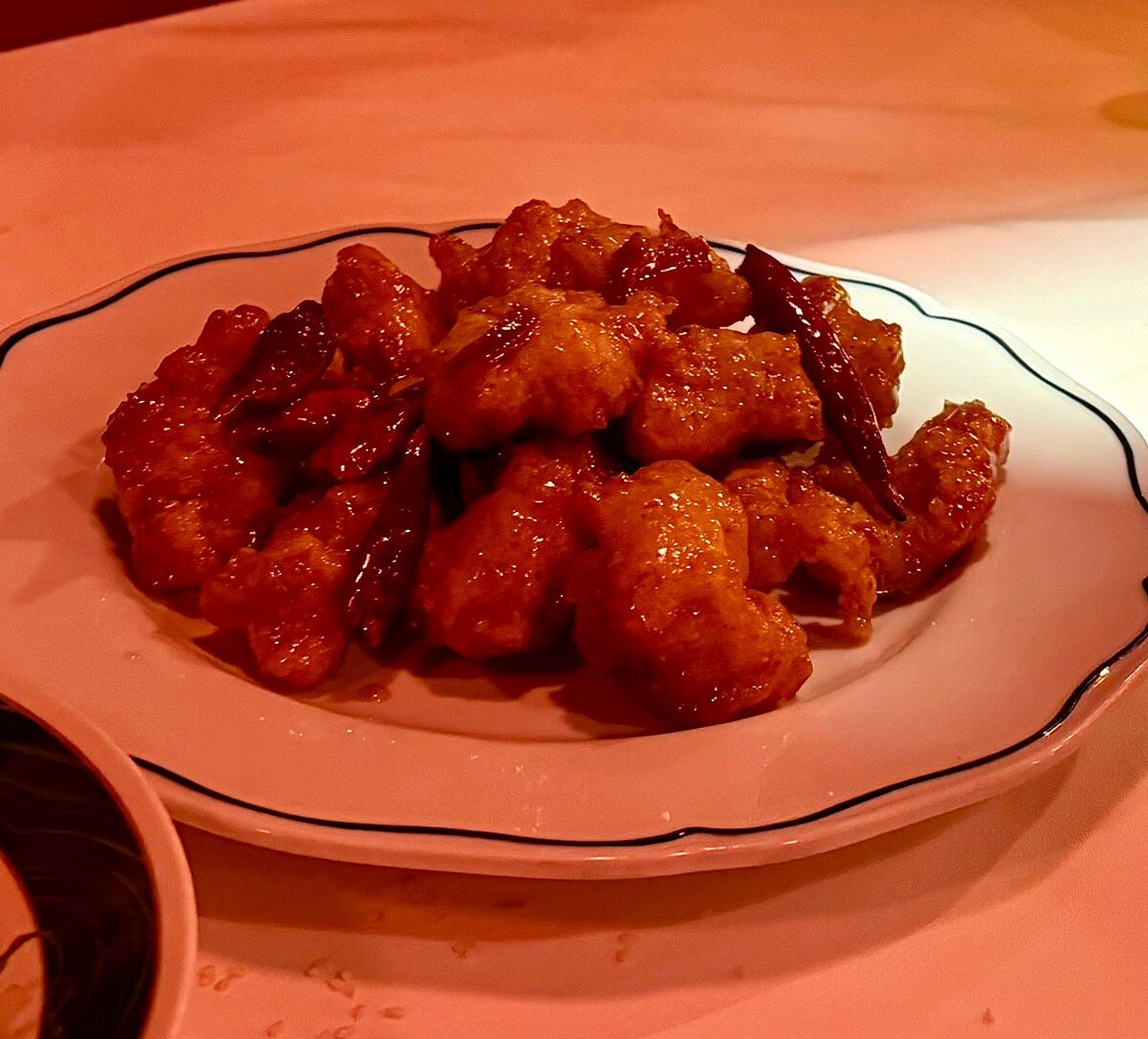Double Luck signature dishes Hennessy Orange Chicken, Crab Rangoon, Double Cooked Pork Belly, Mapo Tofu